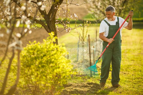 Gardeners carrying out corrective landscaping work
